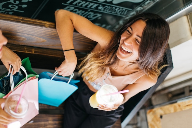 Laughing woman with smoothie