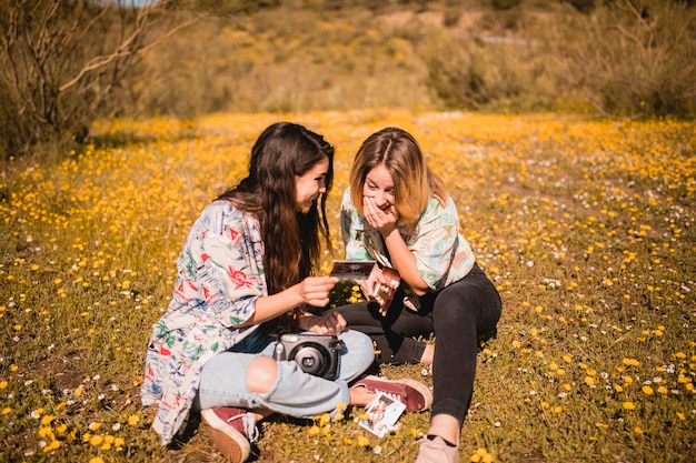 Laughing women looking at picture