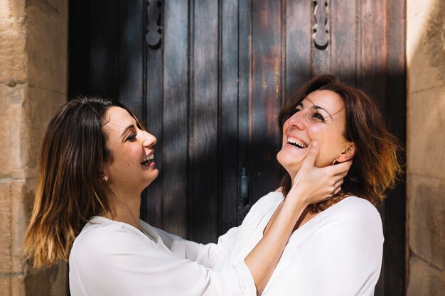 Laughing women near lumber door