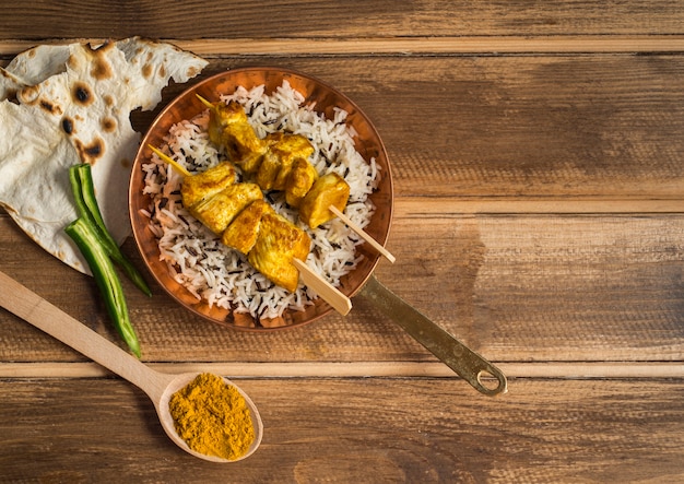 Lavash and spices near rice dish