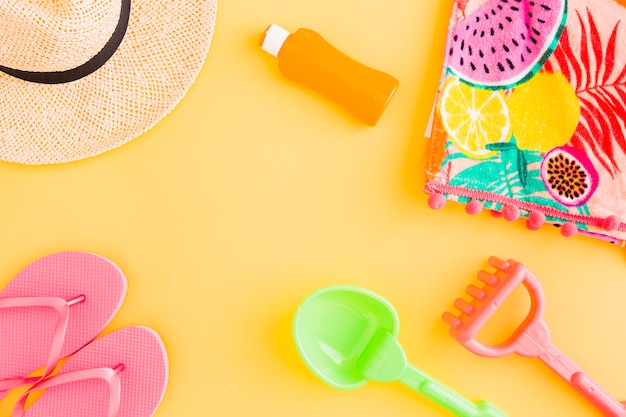 Layout of beach accessories and children toys for summer tropical holiday