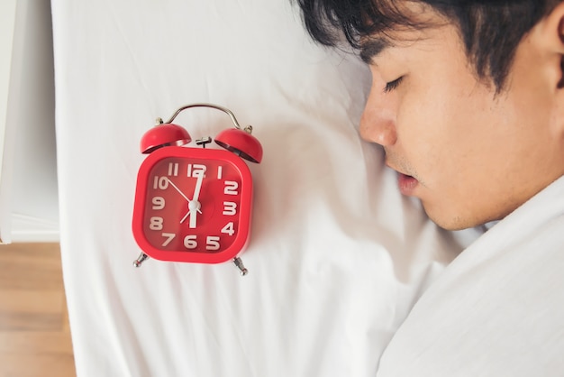 Lazy Man waking up in his bedroom