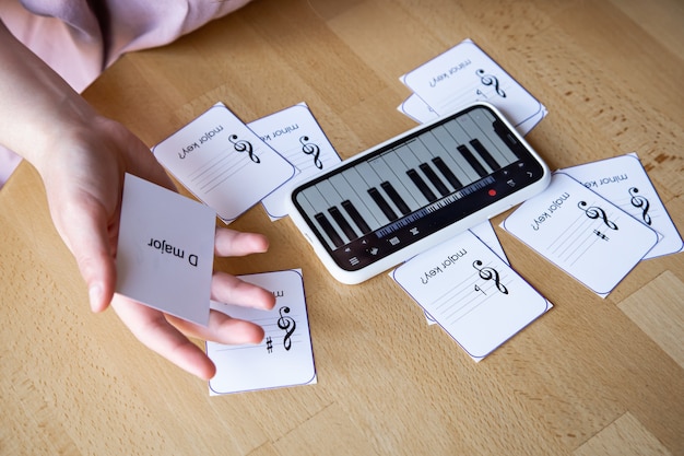 Free photo learn music theory, solfeggio and sheet music with the piano app on your phone and educational flashcards.