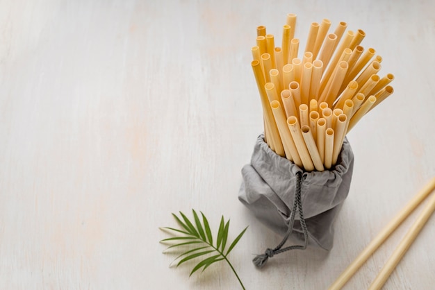 Free photo leaves and eco-friendly environment bamboo tube straws