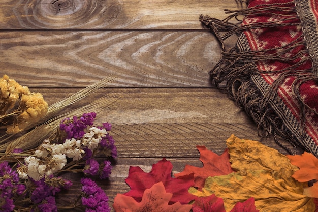 Leaves and flowers near blanket