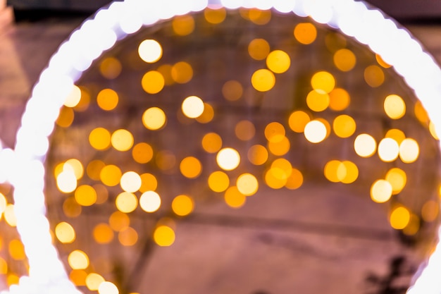 Free photo led circular light against yellow festive bokeh backdrop