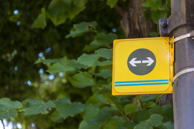 Left and right road arrows on a pole