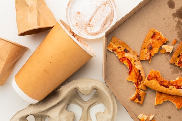 Free photo leftover pizza food and disposable cup