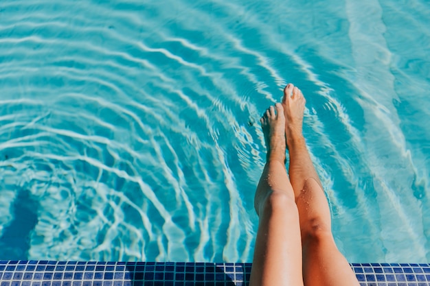 Legs of woman at pool