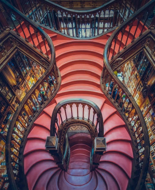 Lello Bookstore with a wooden staircase in the historic center of Porto, Portugal