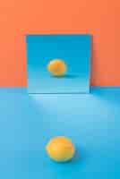 Free photo lemon on blue table isolated on orange