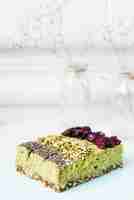 Free photo lemon cake slices with chia seeds; pistachios and dried cranberries toppings