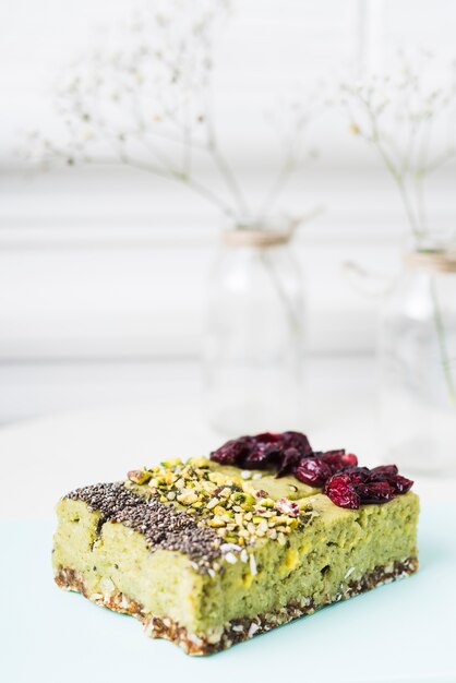 Lemon cake slices with chia seeds; pistachios and dried cranberries toppings