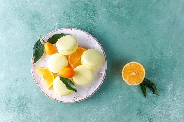 Lemon macaroons with fresh fruits.