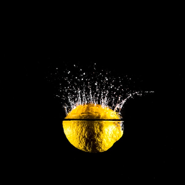 Lemon plunging into the water