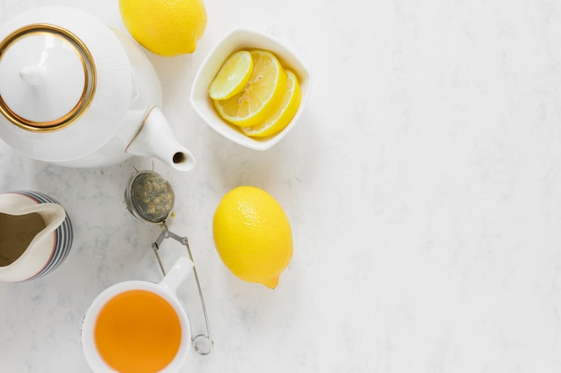 Free Photo lemon tea cup and kettle with copy space