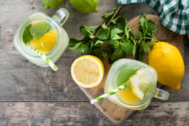 Free photo lemonade drink in a jar glass on wooden table