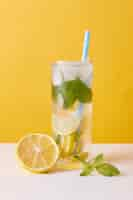 Free photo lemonade with lemon, mint and ice cubes