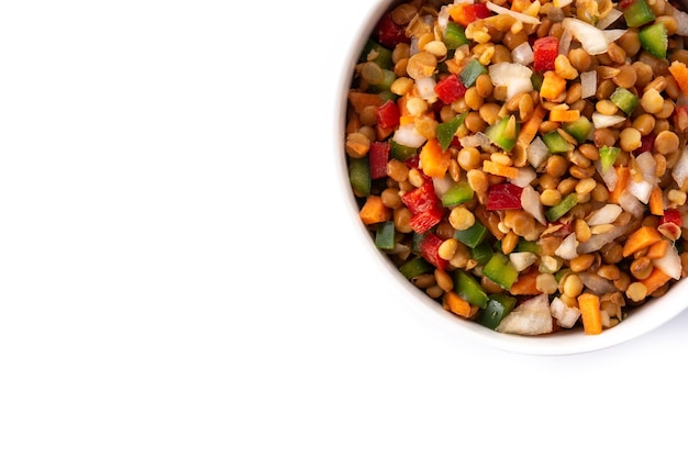 Lentil salad with peppersonion and carrot in a bowl isolated on white background