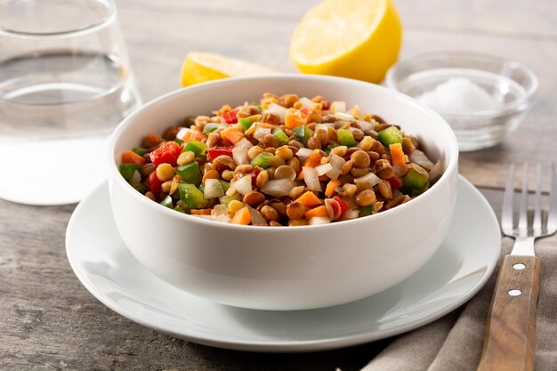 Lentil salad with peppersonion and carrot in bowl