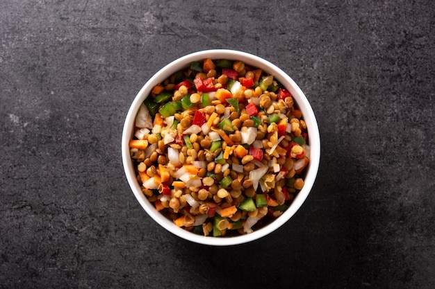 Lentil salad with peppersonion and carrot in bowl