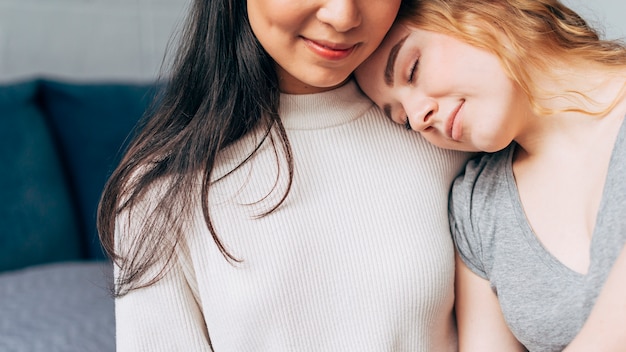 Free photo lesbian couple hugging tenderly