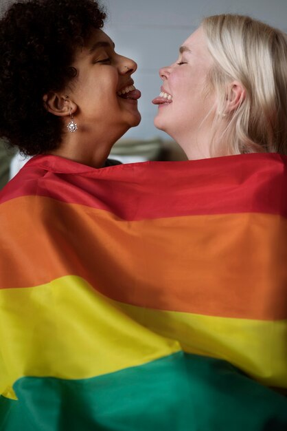 Lesbian couple with rainbow flag