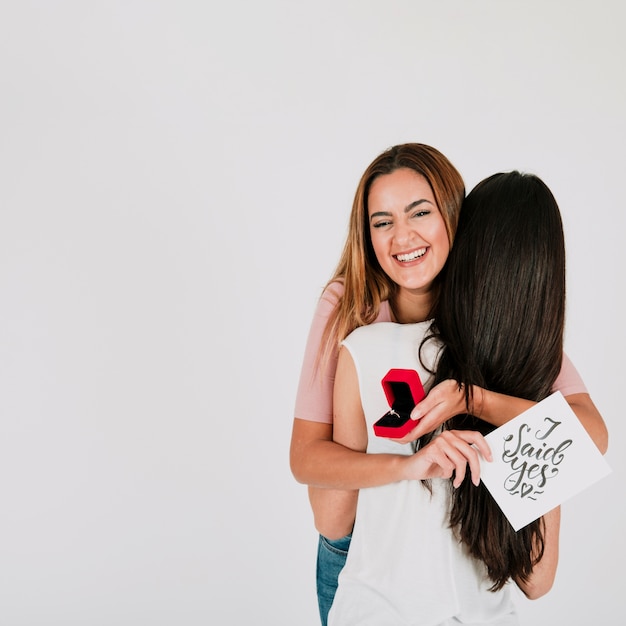 Free Photo lesbian couple with ring embracing