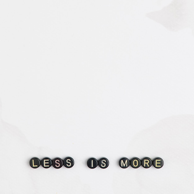 Free Photo less is more beads message quote with beads