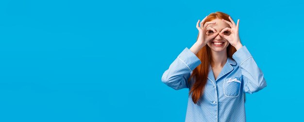 Free Photo lets see what do we have here excited smiling and carefree pretty young redhead girl in nightwear ma