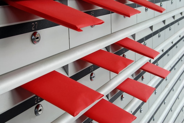 Free Photo letterboxes in rows with numbers in red envelopes