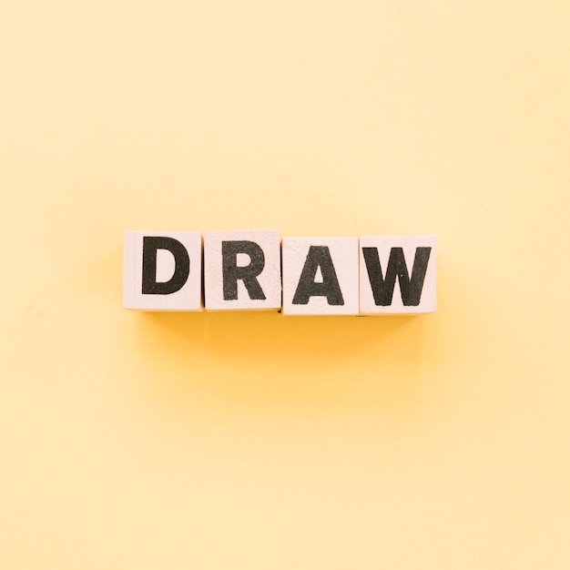 Free Photo letters on cubes forming the word draw