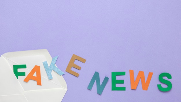 Free photo letters forming fake news message