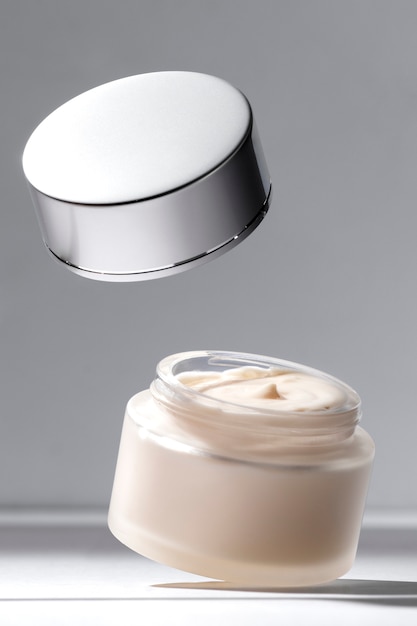 Free photo levitating cosmetic cream display