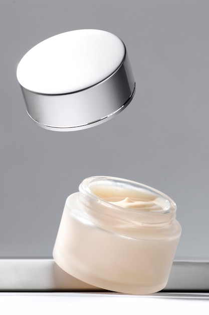 Free photo levitating cosmetic cream display