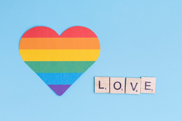 Free photo lgbt heart icon and word love on wooden blocks