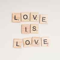 Free photo lgbt motto love is love on white background