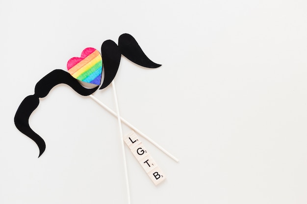 Free photo lgtb inscription with rainbow heart and mustaches