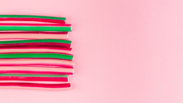 Free photo licorice candies on pink background