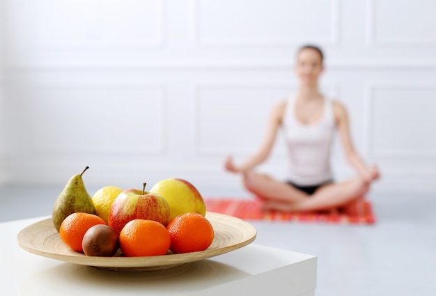 Lifestyle. Beautiful girl during yoga exercise