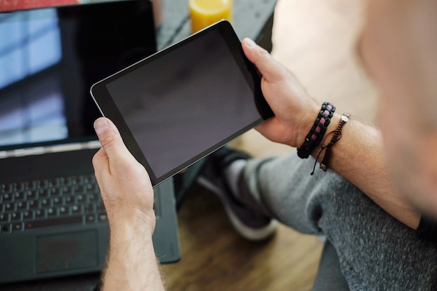 Lifestyle. Man at home with tablet