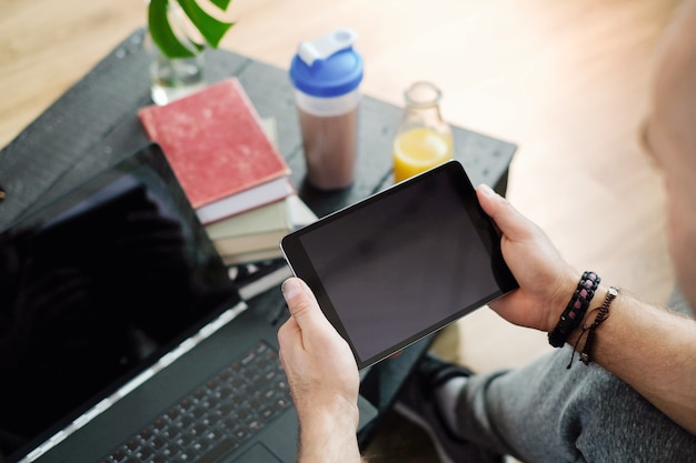 Lifestyle. Man at home with tablet