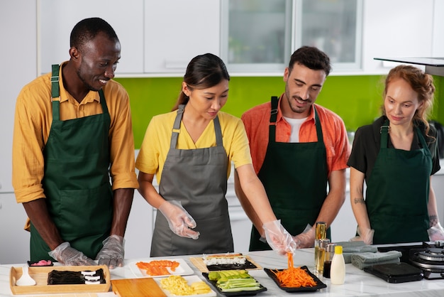 Free photo lifestyle: people learning to make sushi