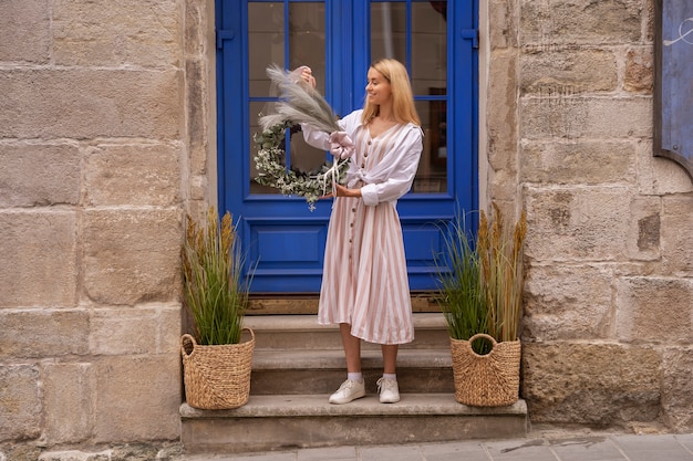 Free Photo lifestyle of person decorating their front door