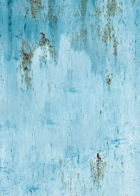 Light blue painted wall texture with cracks