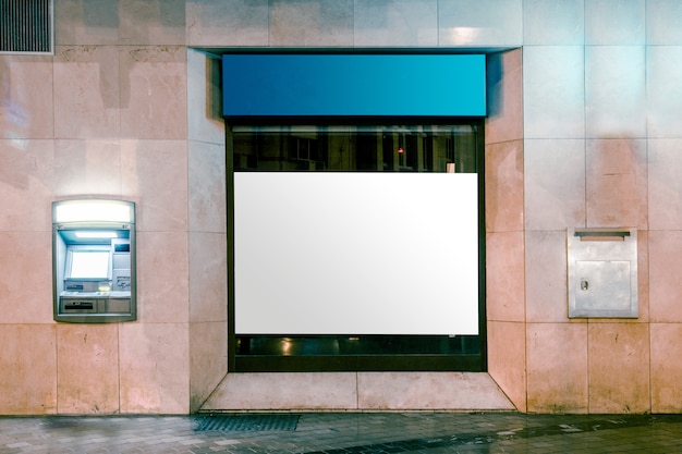 Free photo light box display with white blank space for advertisement by street road