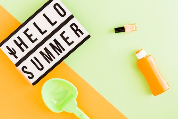 Free photo light box with hello summer text and vacation items