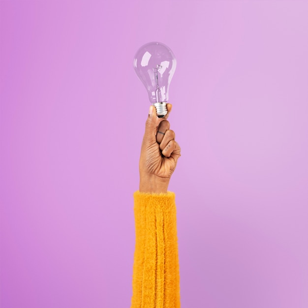 Free Photo light bulb creative business idea symbol held by a hand