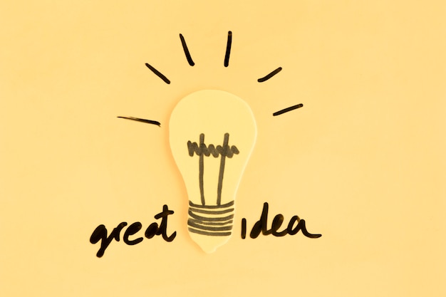 Light bulb with great idea text on yellow background