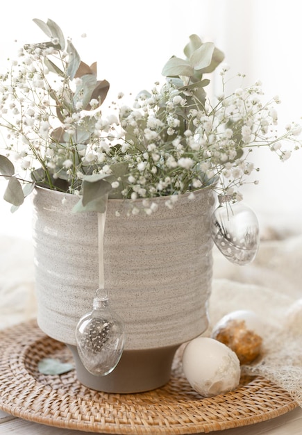 Free Photo light easter composition with easter eggs and gypsophila flowers